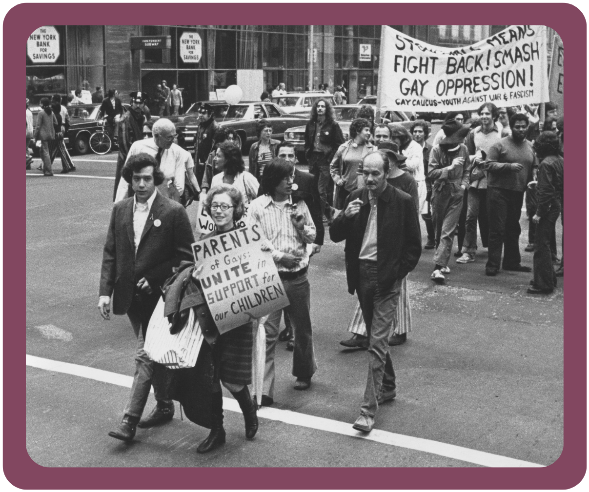 A black and white photo of Jeanne Manford, PFLAG's founder, marching alongside other parents of LGBTQ children