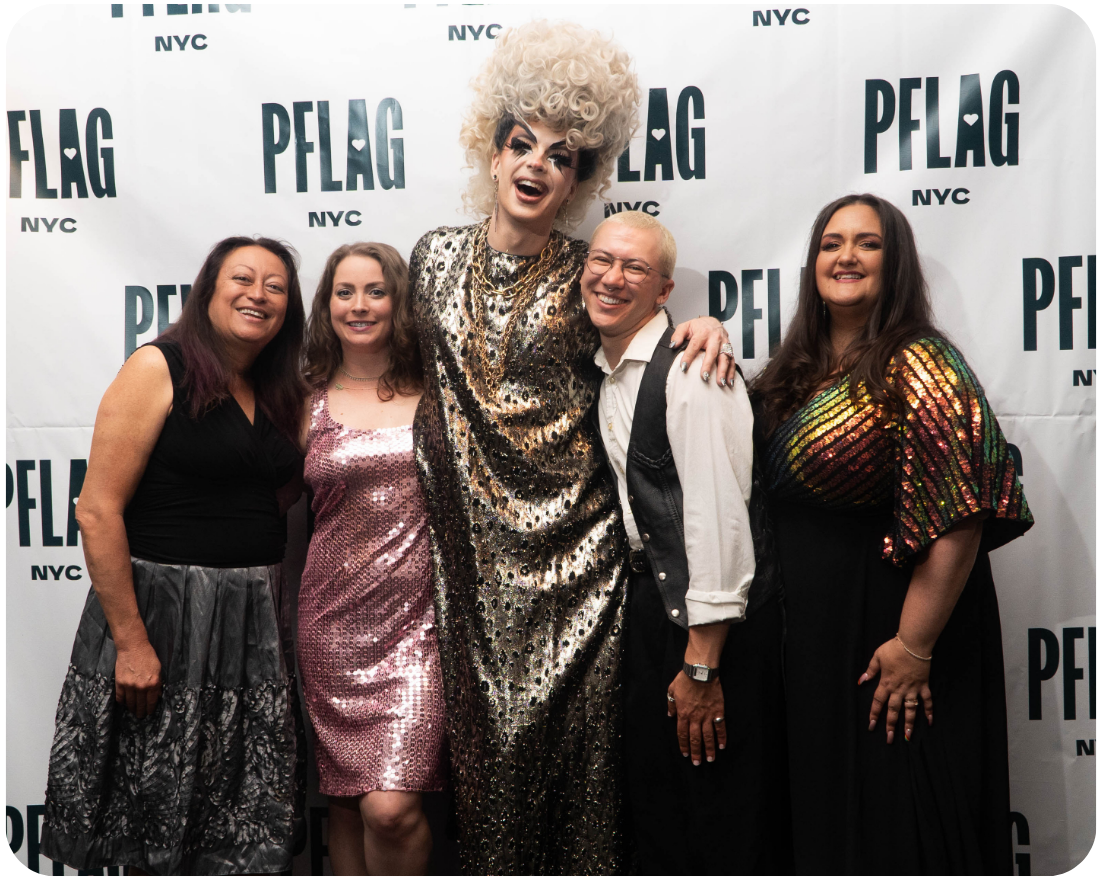 A photo of four PFLAG NYC staff members and one former intern dressed up for the annual gala